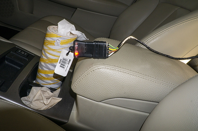 Photograph of Hopkins plug in vehicle harness on 2010 Subaru Outback being tested from the driver' seat.